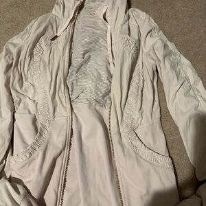 Two light pink Lululemon Women’s jackets